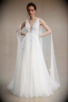 Tulle ball gown with floral appliques and matching cape