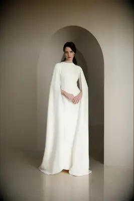 Modern wedding gown with turtleneck and cape sleeves