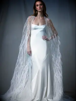 Satin slip dress with dramatic feathered cape attatched