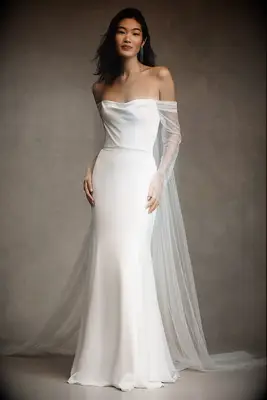 satin wedding gown with tulle cape and sleeves