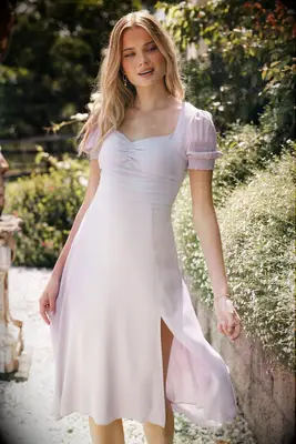 Girl wearing a long blush pink dress