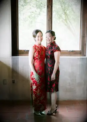 Bride and mother wearing Chinese wedding attire