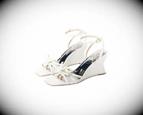 White ankle-strap wedge sandals with bows