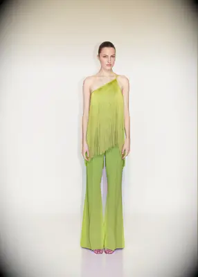 Bright green fringe top and matching flare pants for wedding guest
