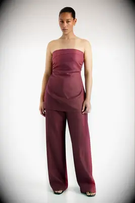 Strapless wine-colored top and matching wide-leg pant set for wedding guest