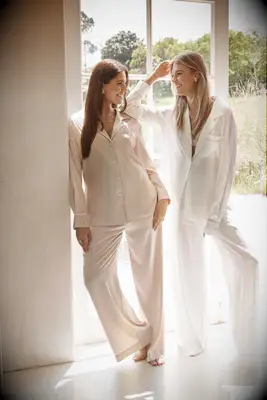 Women wearing long silk pajamas