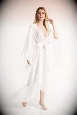 Woman wearing a long flowy white robe