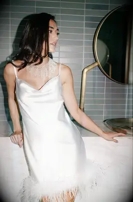 White silk slip dress with feather bottom