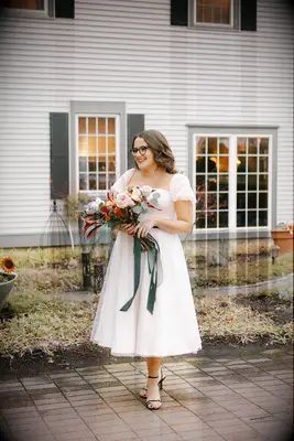 Tiana Crispino in her tea length wedding dress