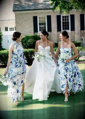 Bride with bridesmaid in a strapless dress