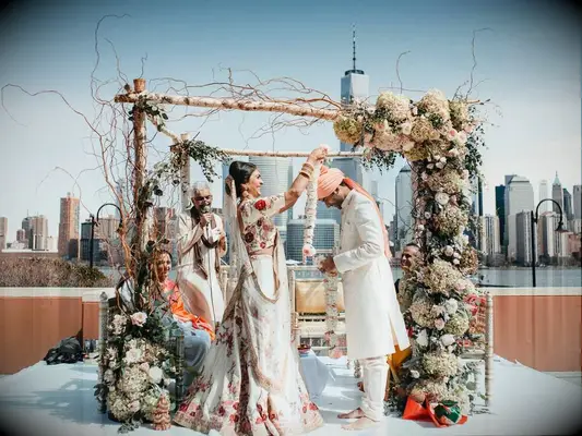 Bride wearing ivory and floral Indian wedding dress