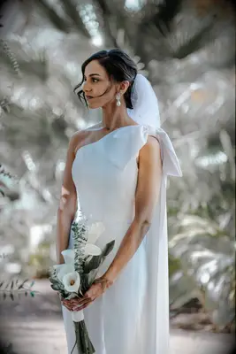 One-shoulder nontraditional bow-detail wedding jumpsuit 