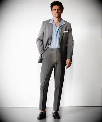 Grey relaxed suit with open button down shirt