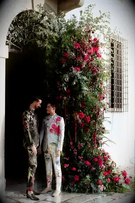 Couple wearing bright, floral suits