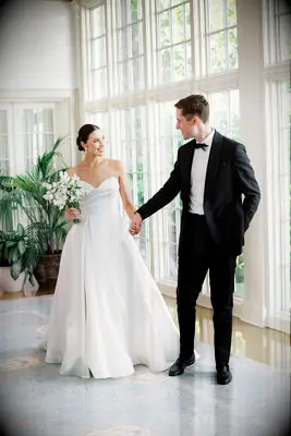 Happy married couple holding hands