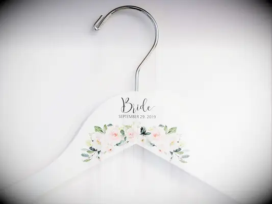 White base with colorful flower design, title and date in minimalist type