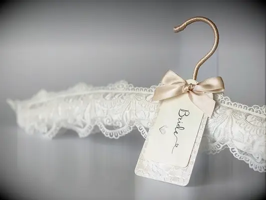 Padded white lace hanger with elegant personalized 