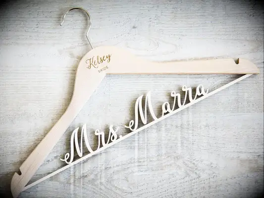 Wooden hanger with name and title, future last name on gold bar