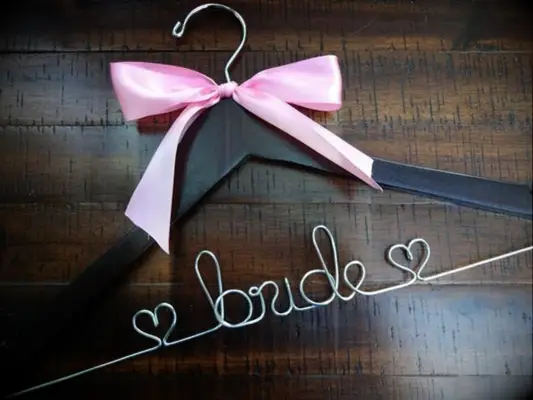 Dark wooden hanger with 