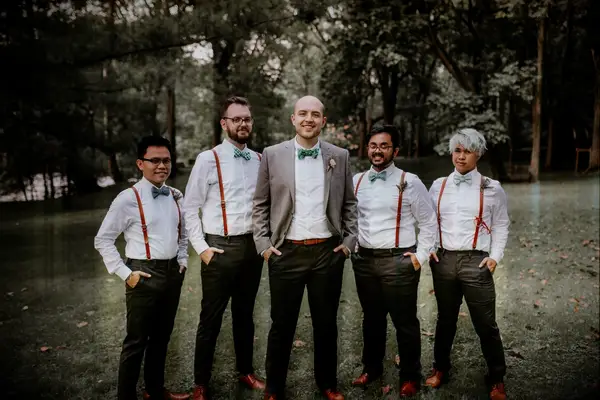 Bohemian Groomsmen in Bright Bow Ties and Red Suspenders