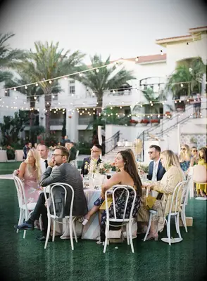 Guests enjoying the outdoors at a backyard wedding reception