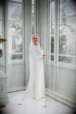 Bride wearing SKIMS butt lifting bodysuit under wedding dress