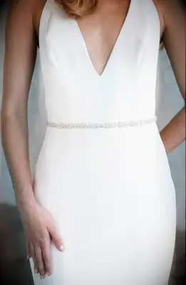 Crystal, opal, and silk sash from Brides & Hairpins