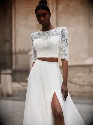 Two-piece wedding gown with long-sleeve lace top and skirt