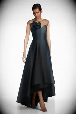 High-low gown with sheer shoulders and statement flower