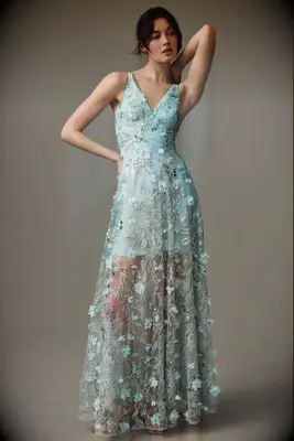 Blue beaded floral gown with V-neckline and sheer skirt