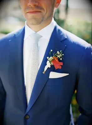 A groom in a bright blue wedding suit