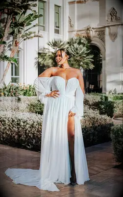 Flowy off-the-shoulder plus-sized wedding dress