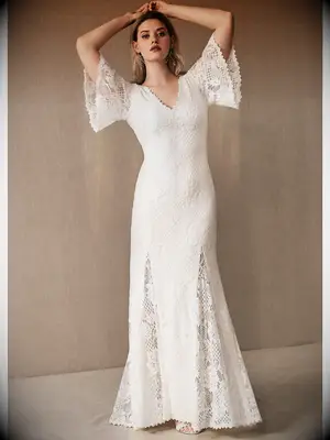 Fit and flare lace wedding dress with flutter sleeves and godet skirt 