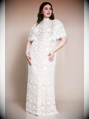 High neck plus-size nude wedding dress with white lace and capelet