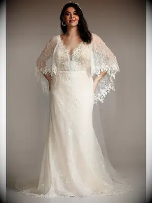 A-line lace plus-size wedding dress with plunging neckline and lace capelet