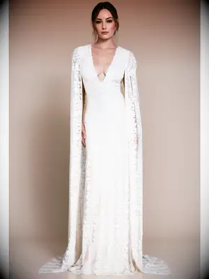 Fitted lace dress with plunging neckline and matching lace cape