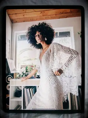 Graphic lace wedding dress with cascading lace capelet