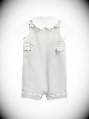 Ralph Lauren sage green button overalls over a white short sleeve shirt from Saks Fifth Avenue
