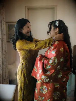 Mother of bride helping daughter on her big day