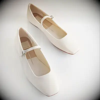 White buckled ballet flats