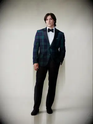 Black and tartan tuxedo for black tie optional wedding from The Black Tux