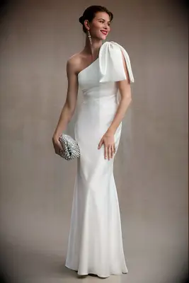 One shoulder wedding dress with an oversized bow. 