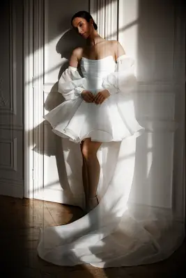 White off the shoulder puff sleeve bridal cape from Olivia Bottega