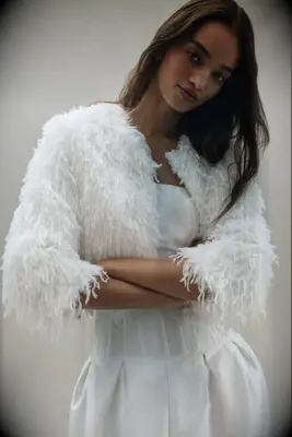 White faux feather cropped bridal jacket from Anthropologie