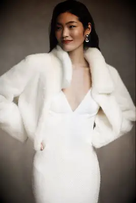 White faux fur cropped bridal jacket from Anthropologie