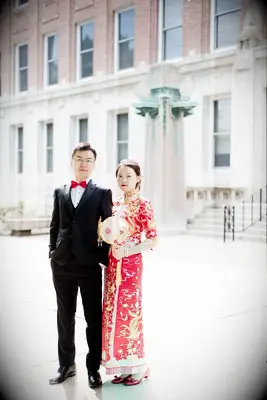 Groom in Western tux with bold red bow tie