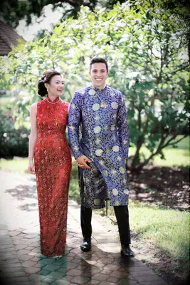 Bride in red qipao wedding dress and groom in blue ma gua