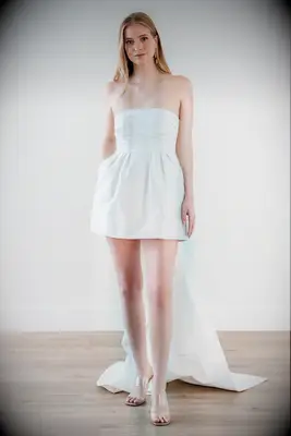 white mini dress with floor length train on back