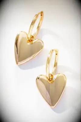 By Anthropologie gold heart huggie earrings