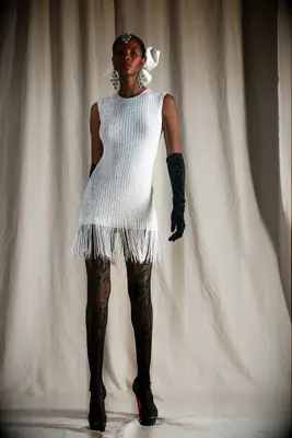 Mini flapper-style white dress by Naeem Khan. 